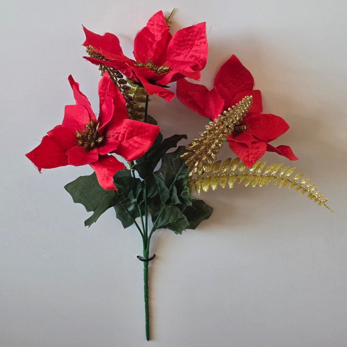 Red and gold sparkle artificial poinsettia Christmas flower