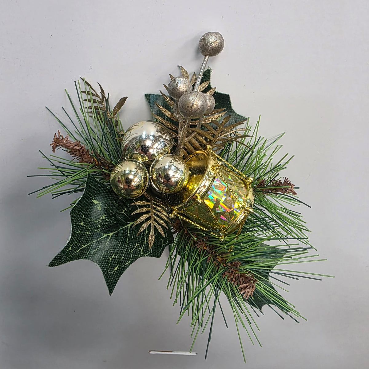 Green and gold Christmas decorative pick with bells and festive foliage