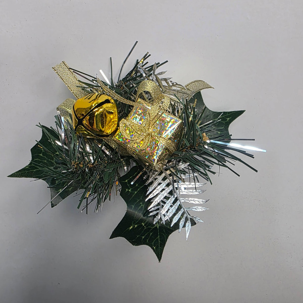 Gold Christmas decorative pick with gift parcel, bell and foliage