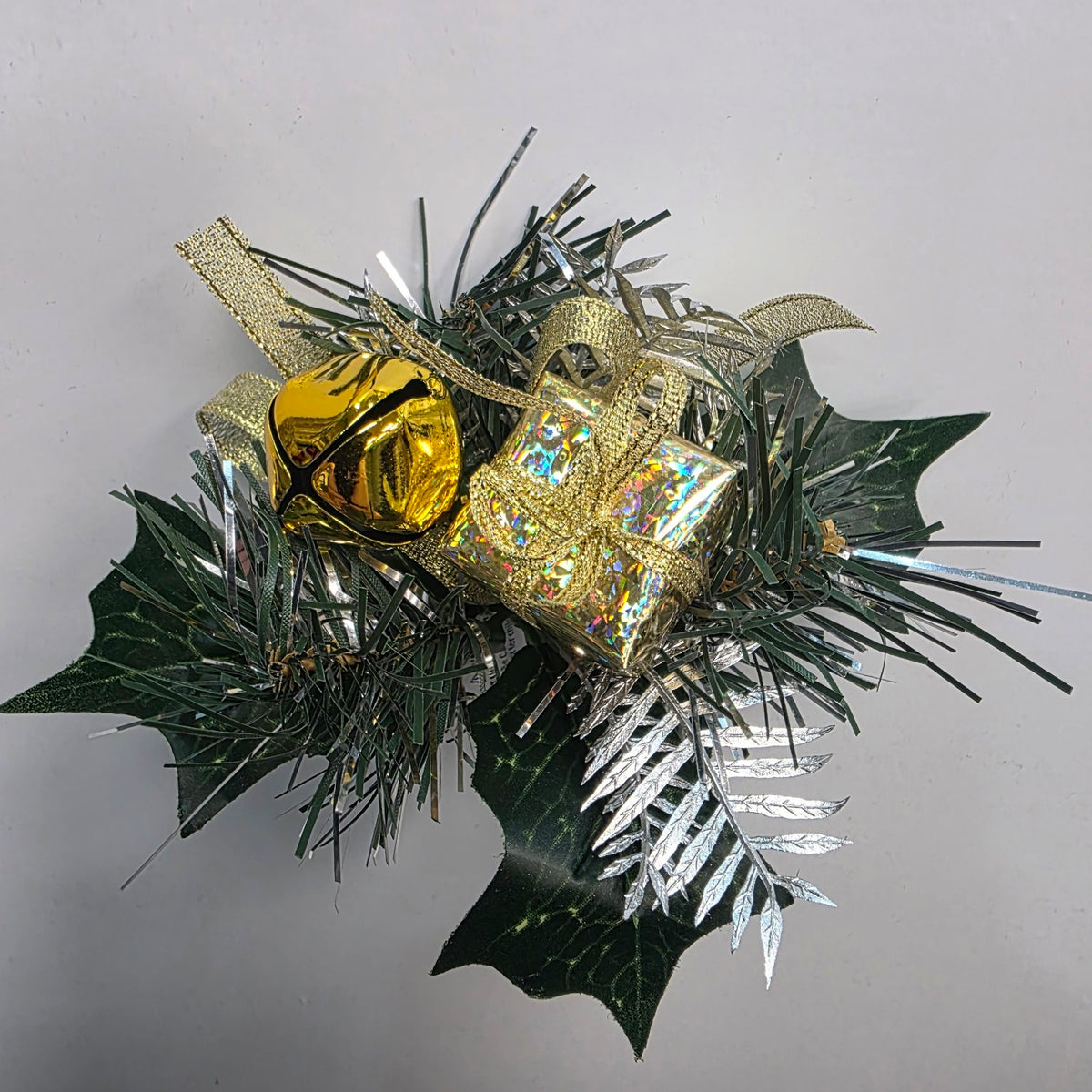 Gold Christmas decorative pick with gift parcel, bell and foliage
