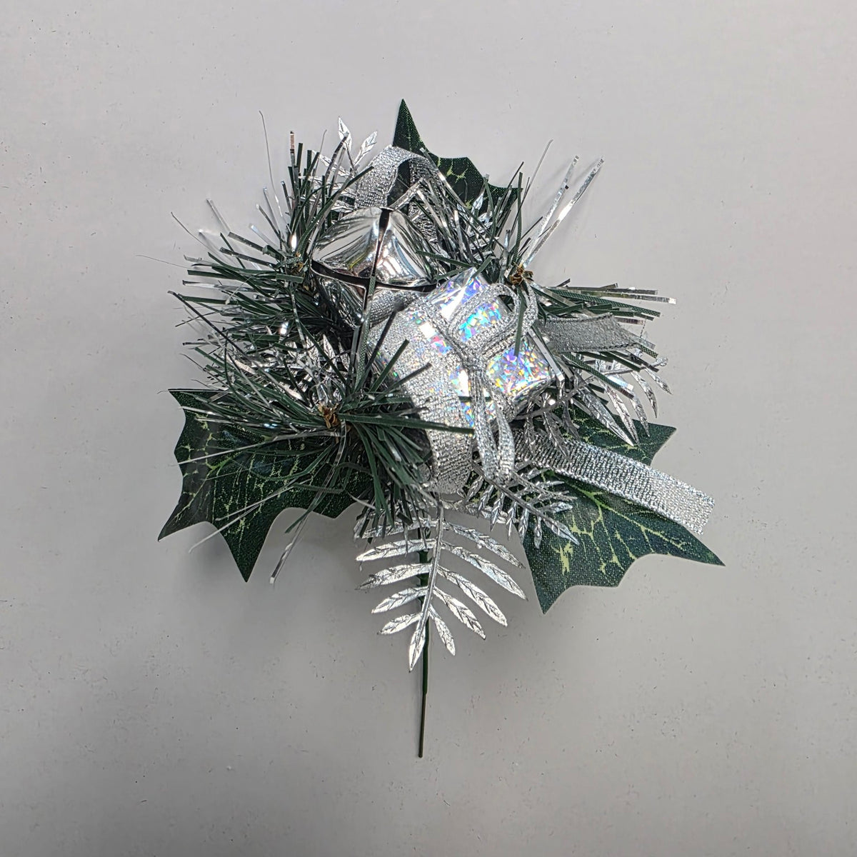 Silver Christmas decorative pick with gift parcel, bells and foliage
