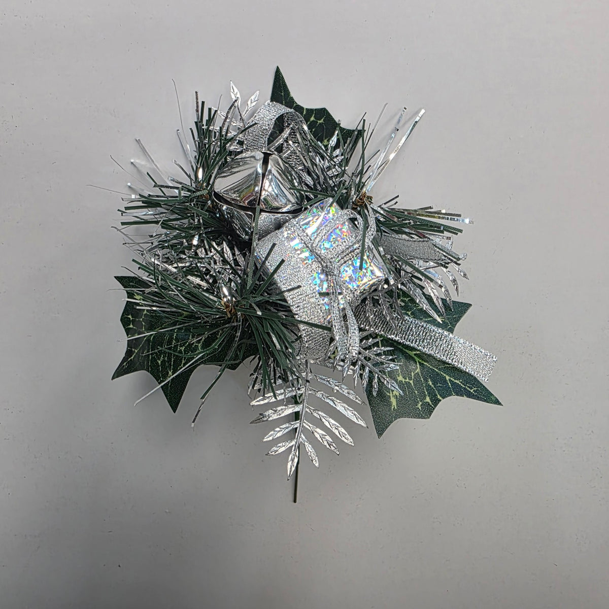 Silver Christmas decorative pick with gift parcel, bells and foliage