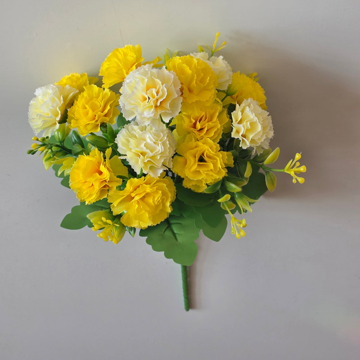 Yellow artificial mini carnation flower bunch - close-up