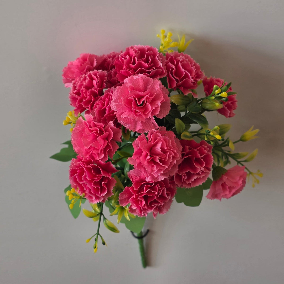 Pink artificial mini carnation flower bunch - close-up