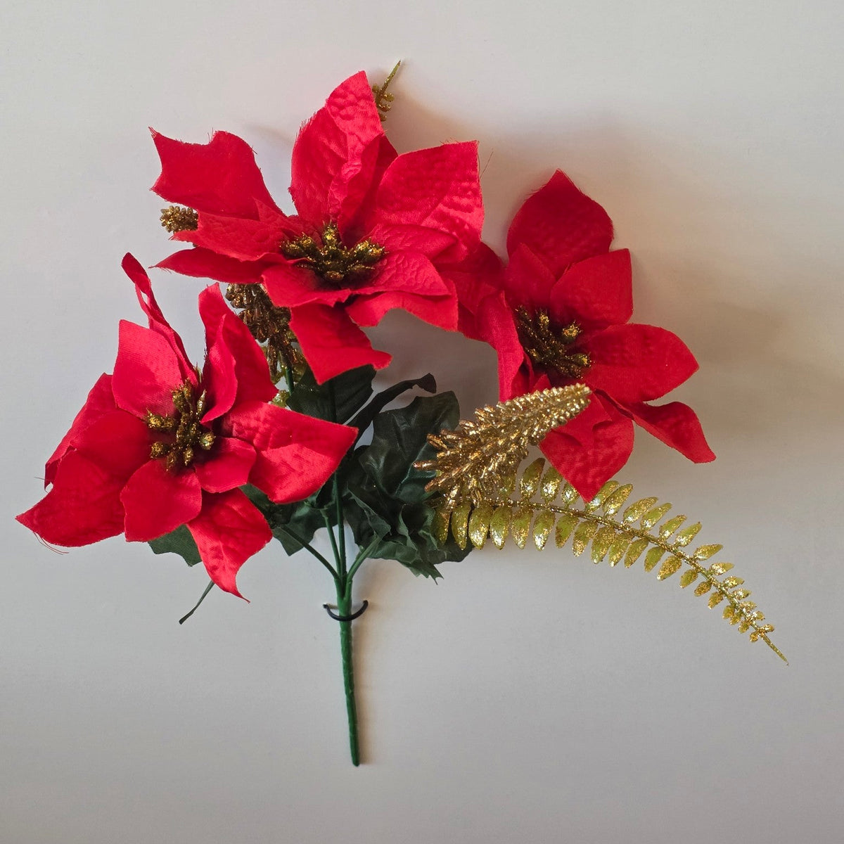 Red and gold sparkle artificial poinsettia Christmas flower